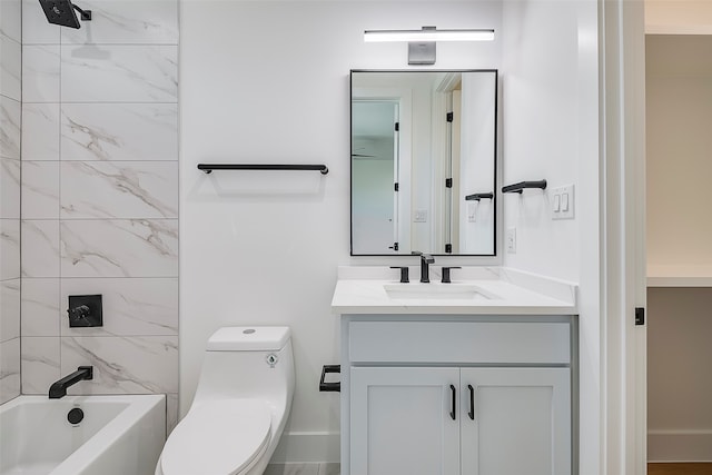 full bathroom with toilet, vanity, and tiled shower / bath