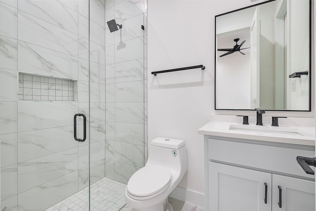 bathroom with toilet, an enclosed shower, and vanity