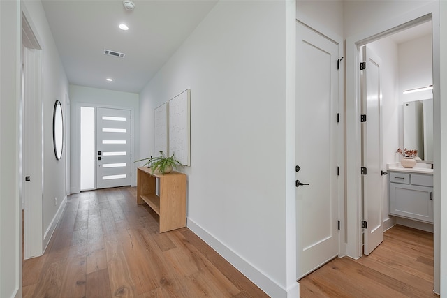 hall featuring light hardwood / wood-style flooring