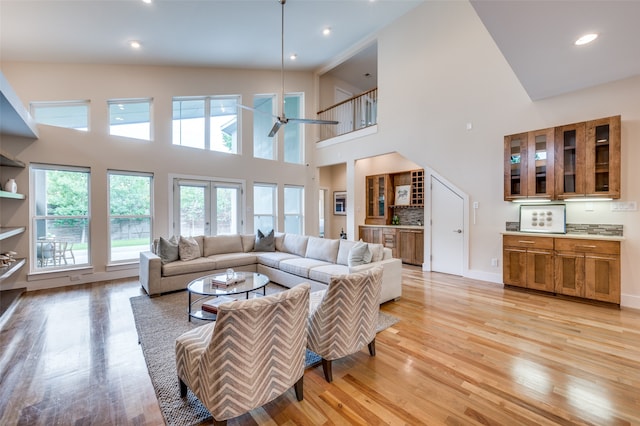 living room featuring french doors and light hardwood / wood-style floors