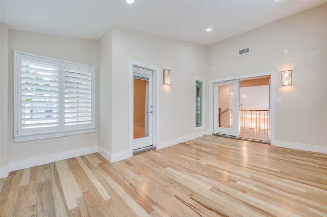 unfurnished room featuring light hardwood / wood-style floors