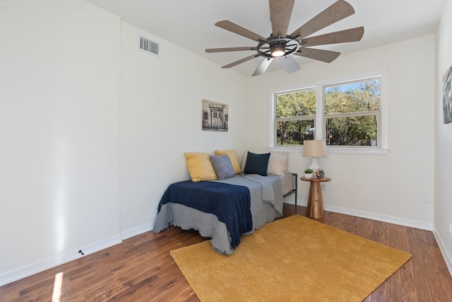 bedroom featuring dark hardwood / wood-style floors and ceiling fan