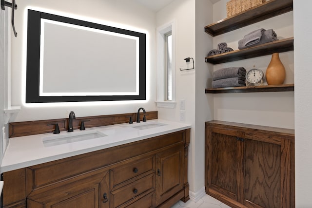 bathroom featuring tile patterned flooring and vanity