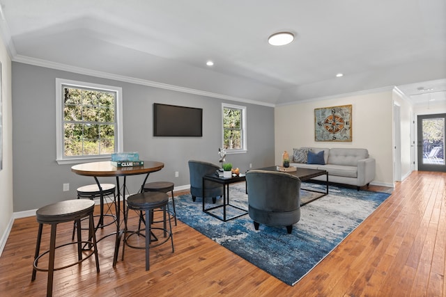 living room featuring hardwood / wood-style floors and ornamental molding