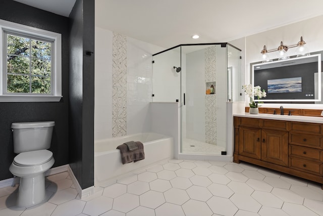 full bathroom with tile patterned flooring, vanity, toilet, and independent shower and bath