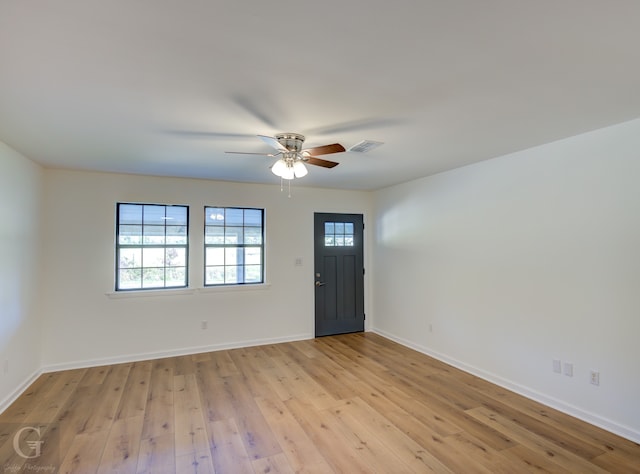 entrance foyer with ceiling fan and light wood-type flooring