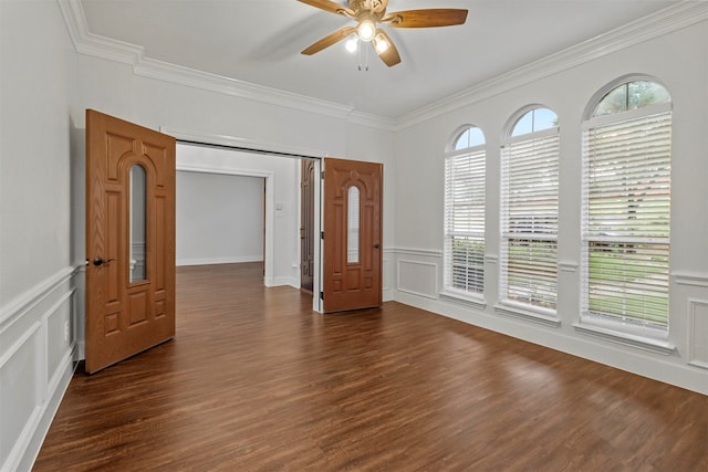 spare room featuring ceiling fan, dark hardwood / wood-style floors, and ornamental molding