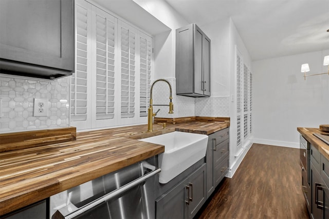 kitchen with butcher block counters, decorative backsplash, and dark hardwood / wood-style flooring