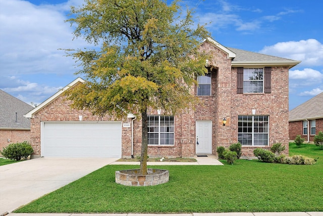 view of front of house featuring a front lawn and a garage