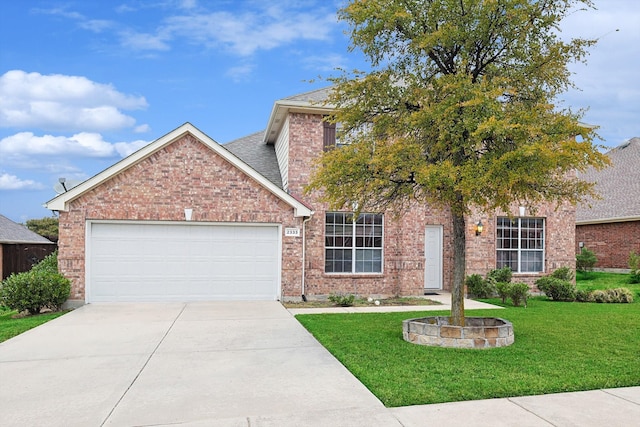 view of front of house with a front lawn and a garage