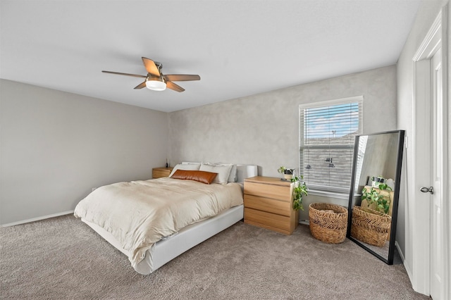 bedroom with ceiling fan and light colored carpet