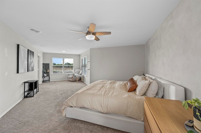 bedroom with ceiling fan and carpet floors