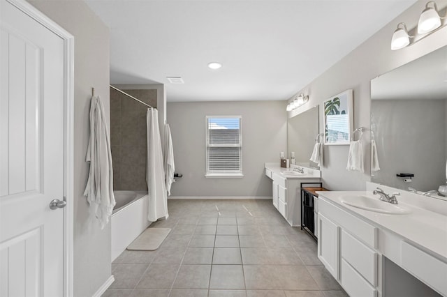 bathroom with tile patterned floors, vanity, and shower / tub combo with curtain