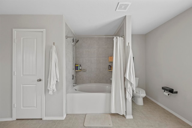 bathroom featuring tile patterned floors, shower / bath combo, and toilet