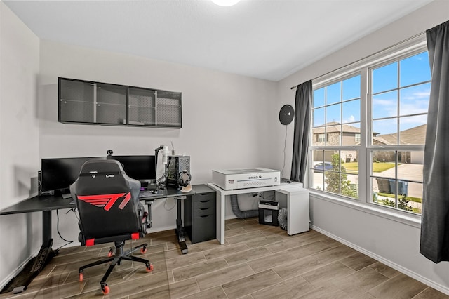 office space with light hardwood / wood-style floors