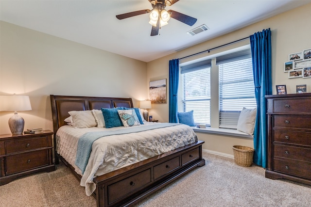 bedroom featuring ceiling fan and light colored carpet