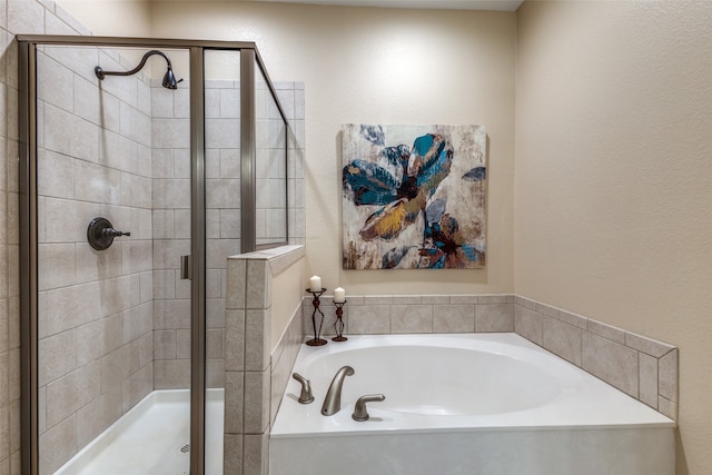 bathroom featuring separate shower and tub