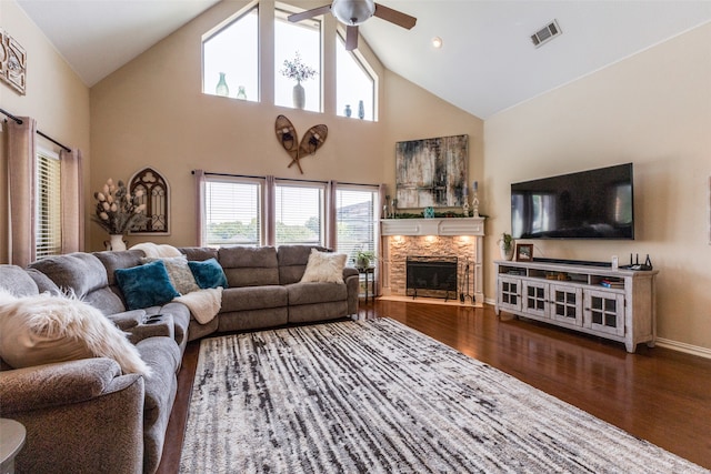 living room with hardwood / wood-style floors, high vaulted ceiling, and a wealth of natural light