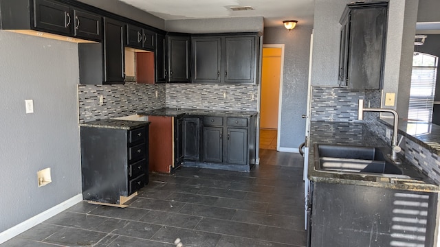 kitchen with tasteful backsplash and sink