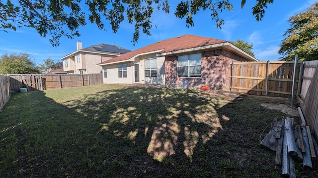 back of house with a yard