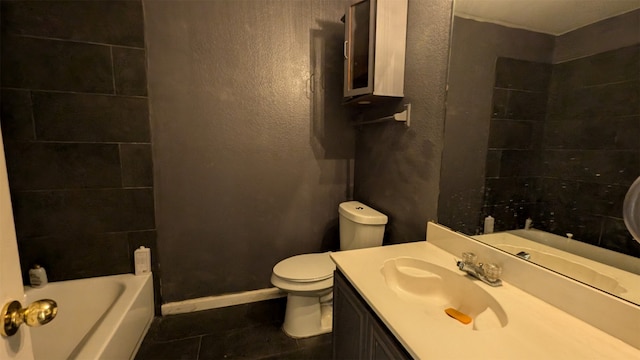 bathroom featuring tile patterned flooring, vanity, and toilet