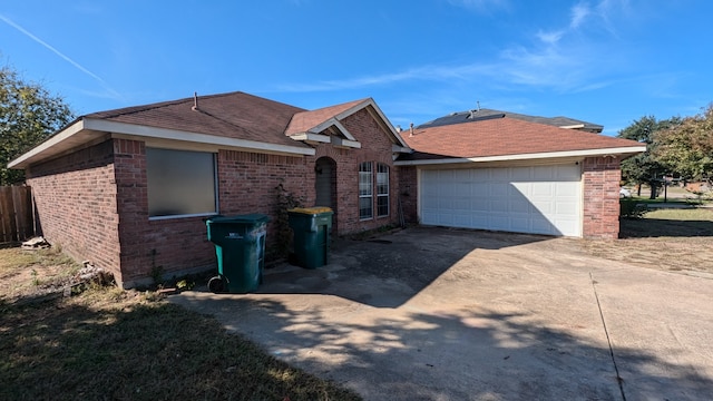 ranch-style home featuring a garage