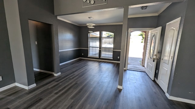 entrance foyer with dark hardwood / wood-style floors and ornamental molding