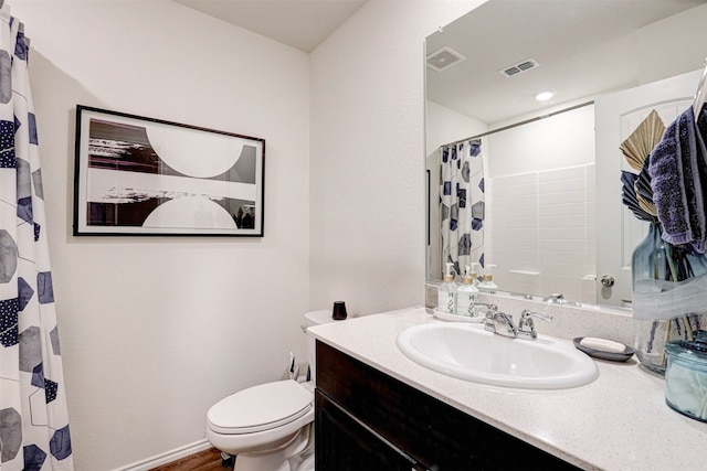 bathroom with hardwood / wood-style floors, vanity, toilet, and a shower with curtain