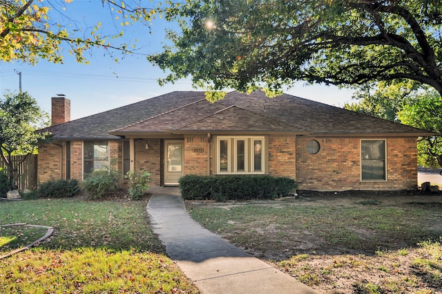 ranch-style house with a front yard