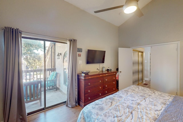 bedroom featuring access to exterior, light wood-type flooring, high vaulted ceiling, and ceiling fan