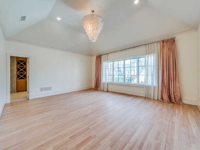 unfurnished room with ornamental molding, light wood-type flooring, an inviting chandelier, and lofted ceiling