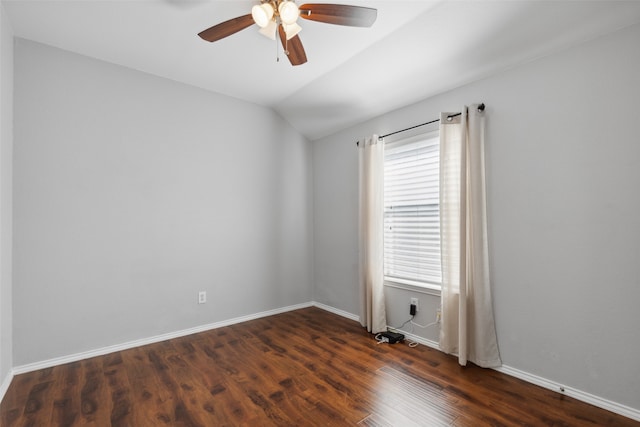 spare room with lofted ceiling, ceiling fan, and dark wood-type flooring