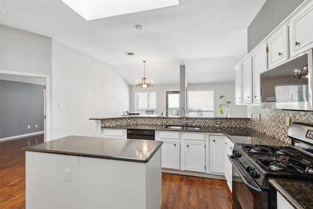 kitchen with dark hardwood / wood-style flooring, sink, white cabinets, and appliances with stainless steel finishes