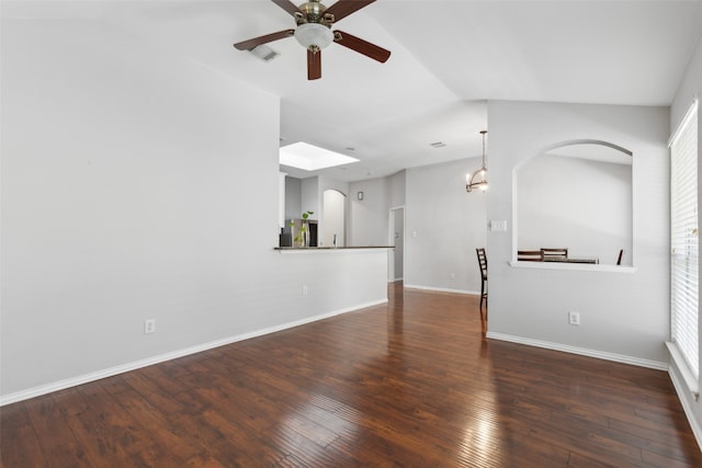 unfurnished living room featuring ceiling fan, dark hardwood / wood-style flooring, and lofted ceiling