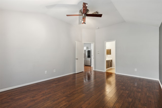 empty room with ceiling fan, dark hardwood / wood-style flooring, and lofted ceiling