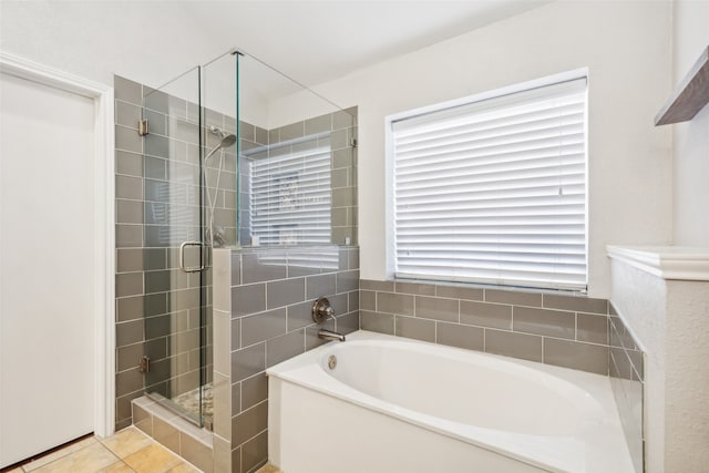 bathroom with tile patterned floors and separate shower and tub