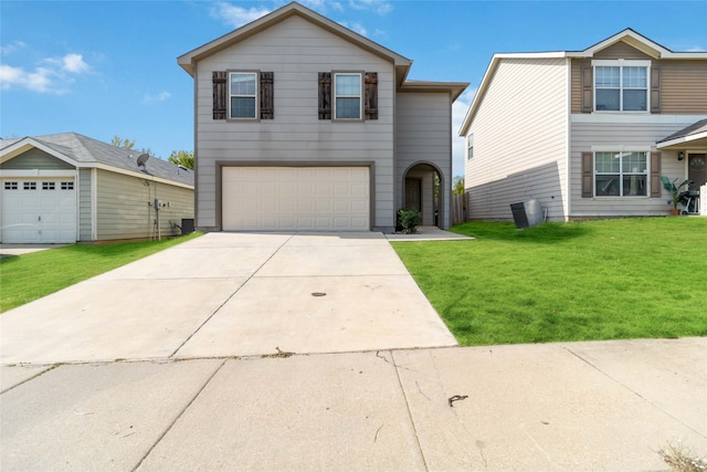 view of front of house with a garage and a front lawn