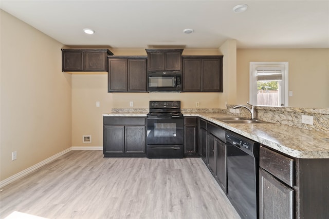 kitchen featuring sink, light hardwood / wood-style floors, dark brown cabinetry, and black appliances