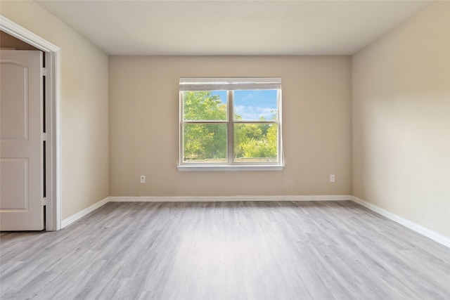 unfurnished room with light hardwood / wood-style flooring