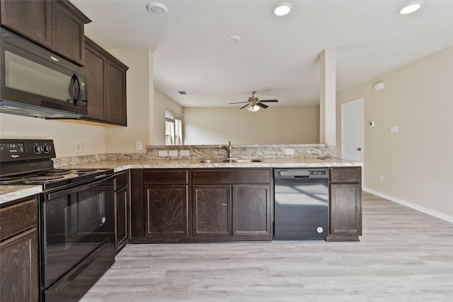 kitchen with dark brown cabinetry, ceiling fan, sink, black appliances, and light hardwood / wood-style flooring