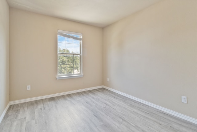 spare room with light wood-type flooring