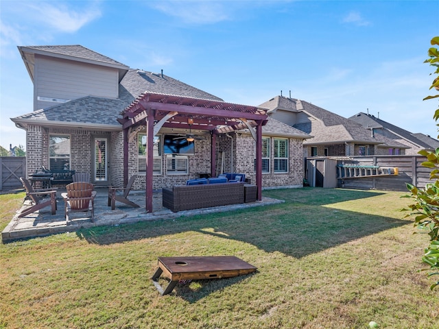 rear view of property featuring outdoor lounge area, a pergola, a yard, and a patio