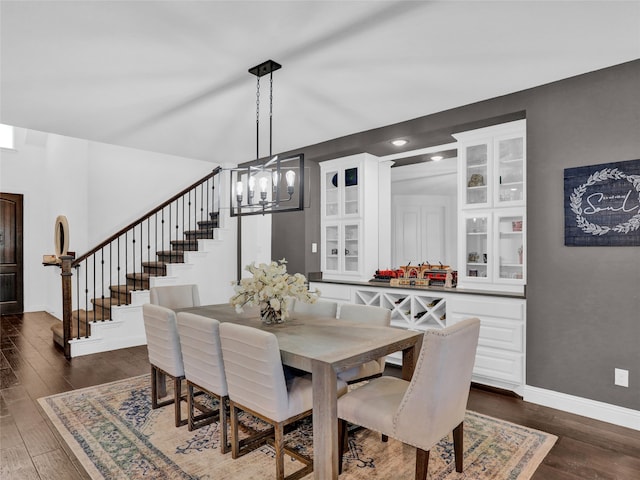 dining room featuring a chandelier and dark hardwood / wood-style floors