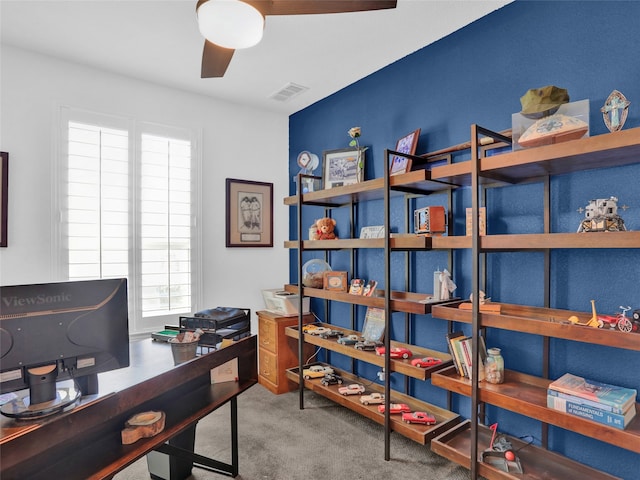 carpeted home office featuring ceiling fan and a healthy amount of sunlight