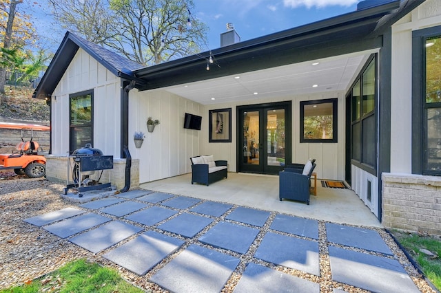 back of house featuring french doors and a patio