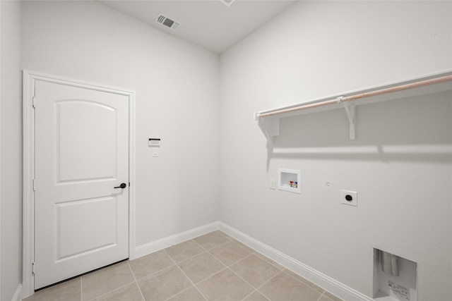 laundry room with washer hookup, gas dryer hookup, electric dryer hookup, and light tile patterned flooring