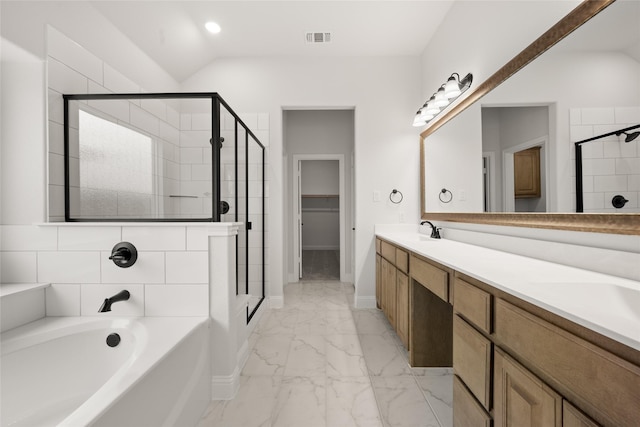 bathroom featuring vanity, vaulted ceiling, and separate shower and tub