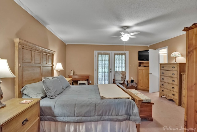 carpeted bedroom with access to exterior, french doors, a textured ceiling, ceiling fan, and crown molding