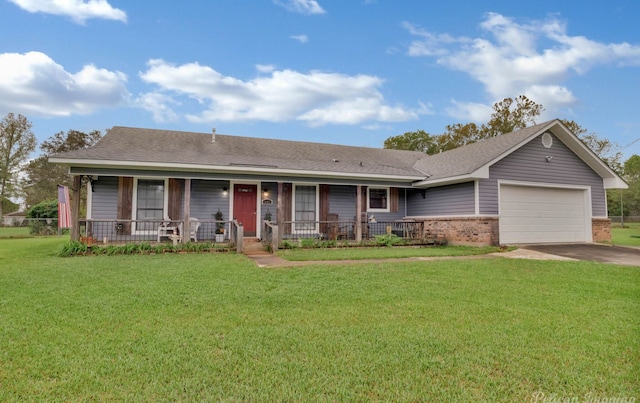 single story home with covered porch, a garage, and a front lawn