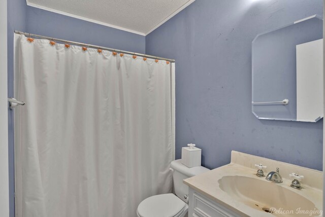 bathroom with toilet, crown molding, a textured ceiling, and vanity